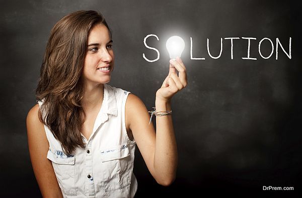 young woman holding a lightbulb