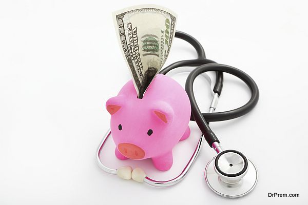 Piggy bank, dollar and stethoscope