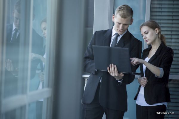 Young workers using laptop