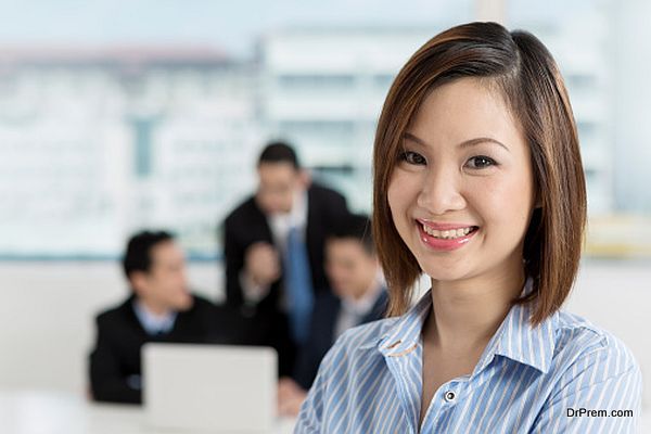 Asian Businesswoman leading a business team