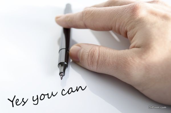 Pen in the hand isolated over white background Yes you can concept