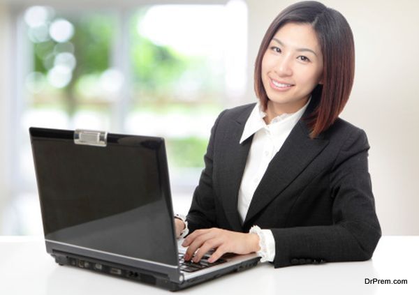 Business woman using computer at office