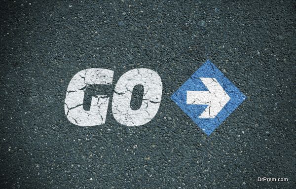Road surface with the word go and an arrow sign