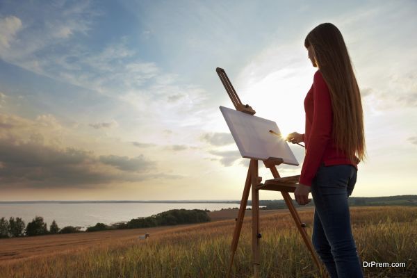 artist painting an sea landscape