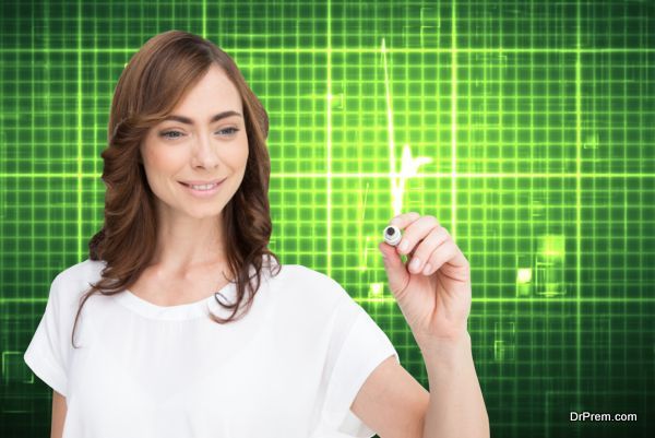 Composite image of smiling businesswoman holding marker