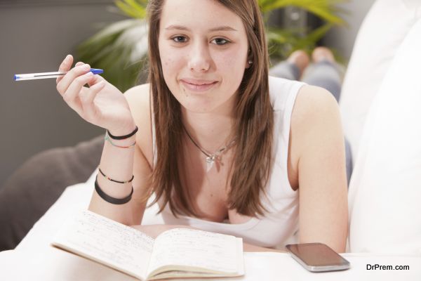 Girl studying on a sofa