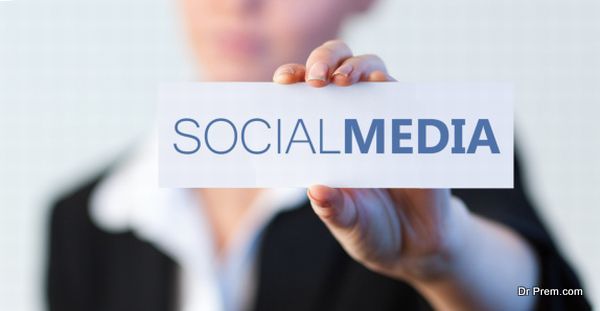 Businesswoman holding a label with social media written on it