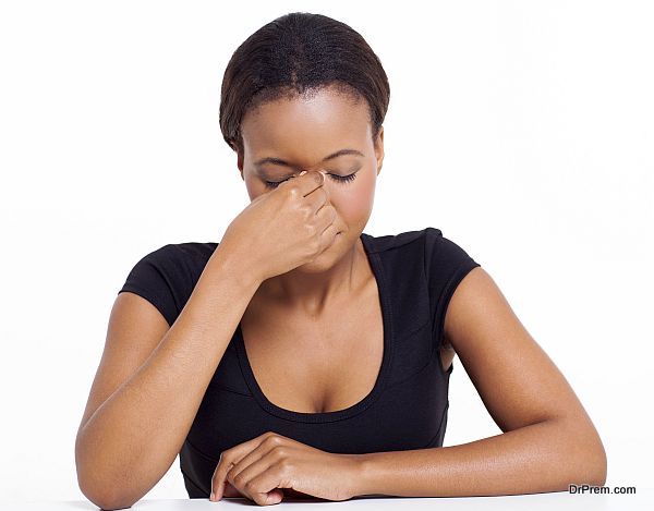 stressed african businesswoman having headache isolated on white