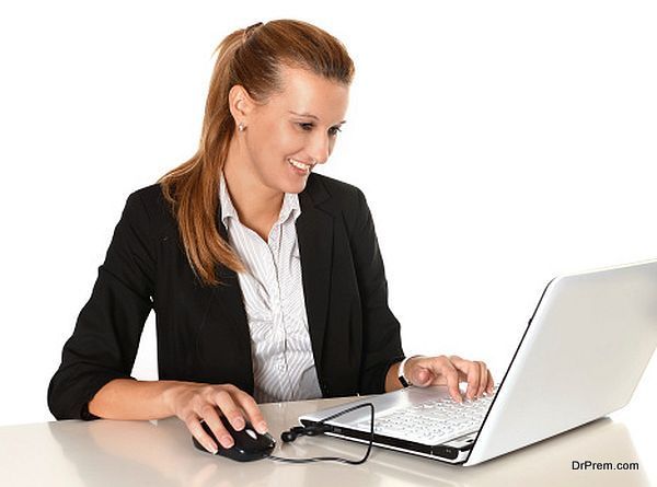 Young Attractive Business Woman working in Computer