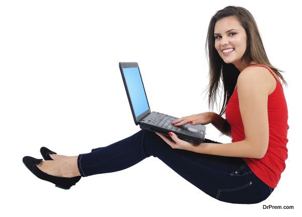 Isolated young casual girl with laptop