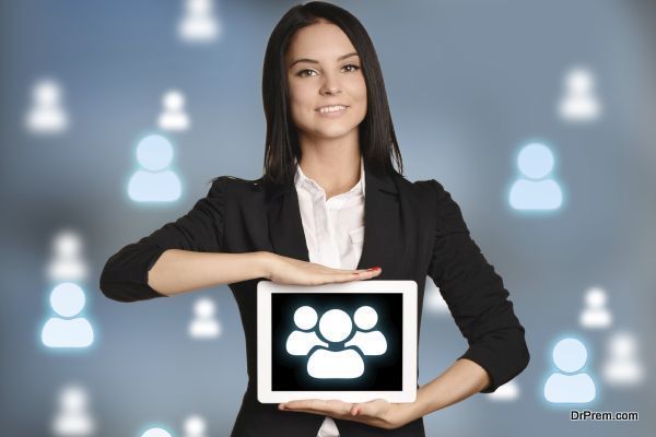 Young girl holding tablet with icon people team.