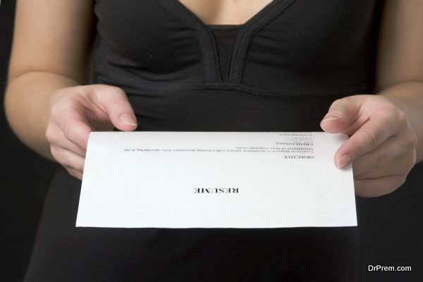 Closeup of hands. The woman holds the resume.