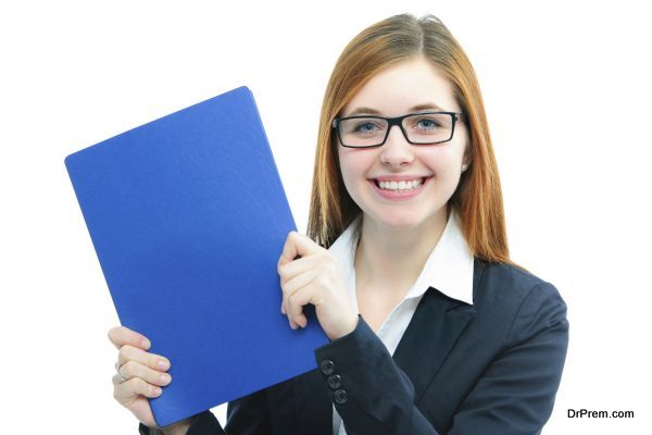 Happy young candidate holding files for a job interview