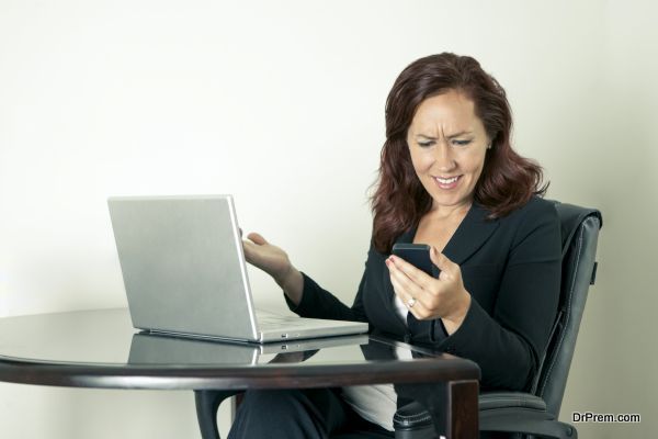 Woman looking at Mobile Phone