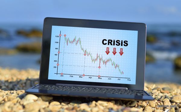 laptop with crisis chart