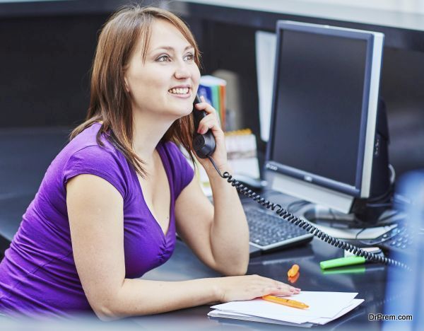 Beautiful young receptionist at work