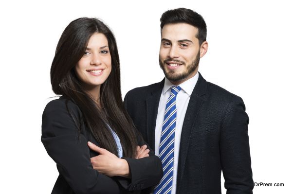 Two smiling business partners. Isolated on white.