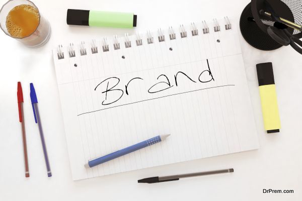 Brand - handwritten text in a notebook on a desk - 3d render illustration.