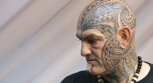 A picture shows a man with facial tattoo
