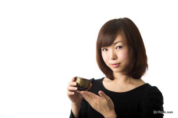 Japanese Woman Holding Tea Cup