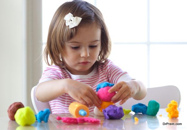 Girl playing with play dough
