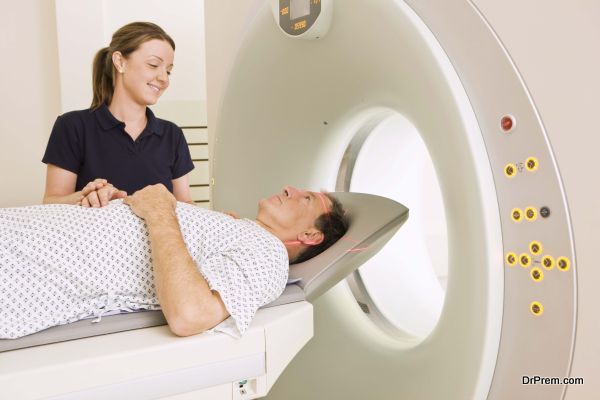 Technician with patient getting CAT scan