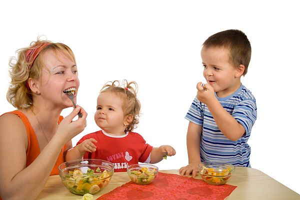 mother and children eating
