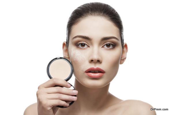 Girl with pressed powder in hand