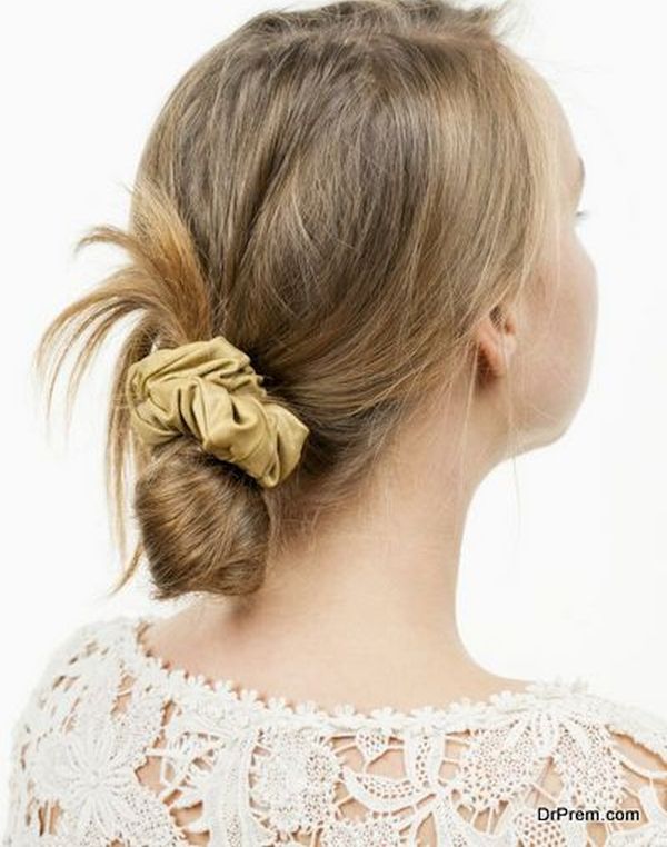 Young woman with casual messy bun hairdo