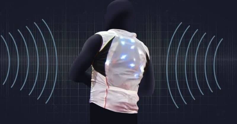 Wearable vest to enable better hearing