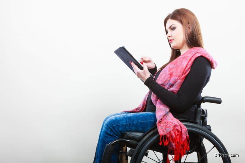 Disabled student with tablet ebook.