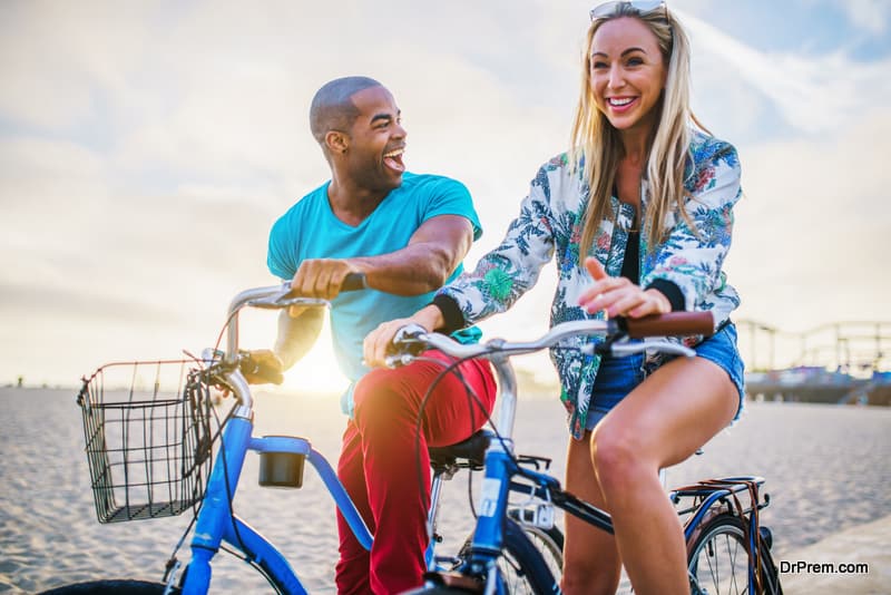 happy couple riding bikes together 