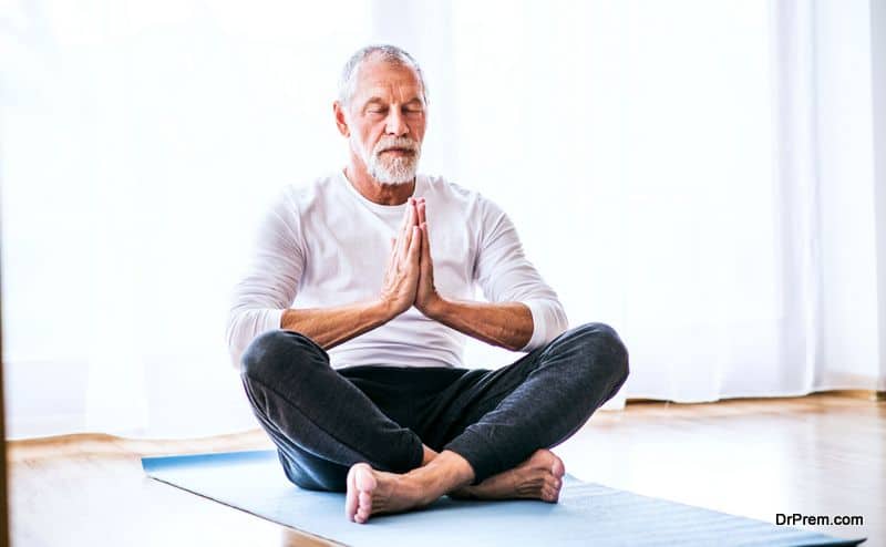 senior male doing yoga