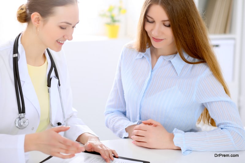 WOMAN VISITING DOCTOR