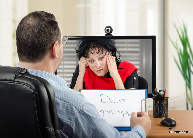 Online-psychiatrist-uses-video-conferencing-to-communicate-remotely-with-depressed-woman