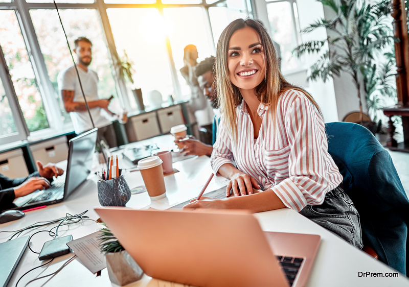 Portrait of beautiful young woman working in the office. Selective focus