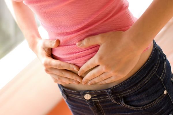 Girl holding stomach