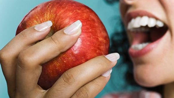 GTY_woman_eating_apple_sr_140514_16x9_608