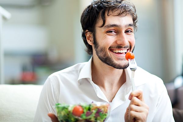 bigstock-Young-man-eating-a-healthy-sal-43484335