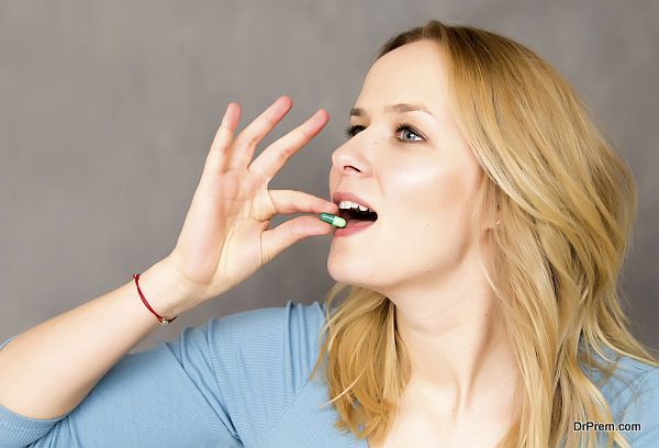 woman consuming Contraceptive pills