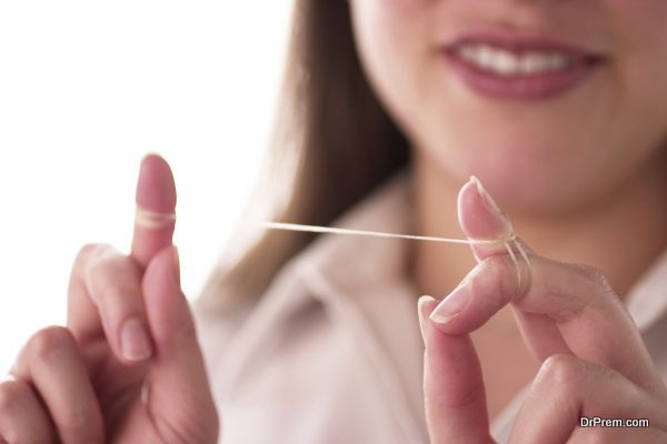 Woman preparing to floss