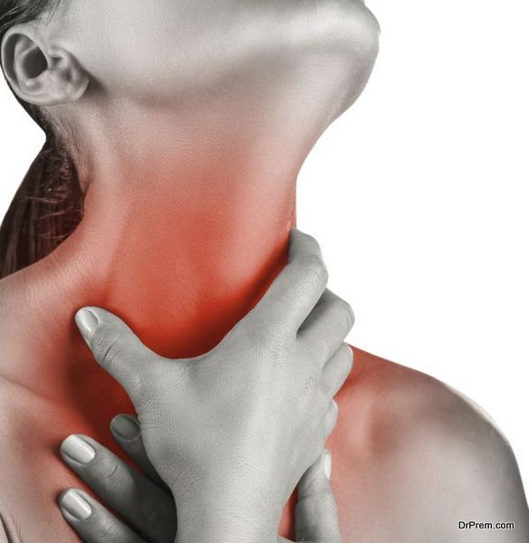Woman holding his throat in pain isolated on white background