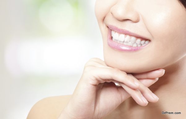 Beautiful young woman teeth close up