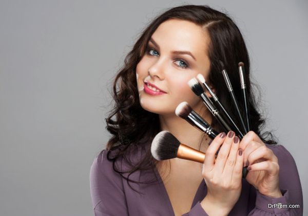 Woman with makeup brushes