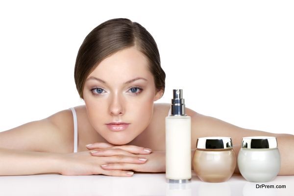 young woman and skincare products