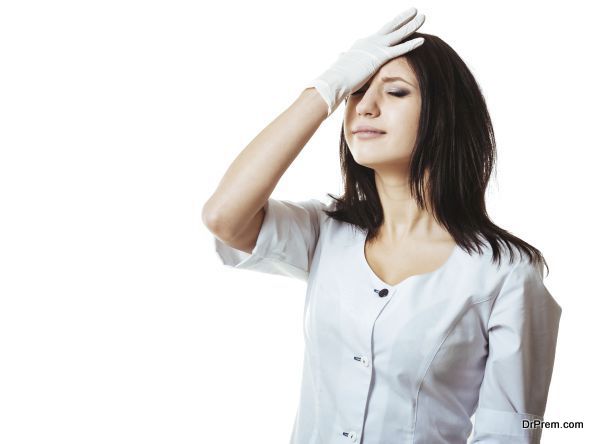 Medical doctor woman with stethoscope have a problem, hold hand head stress , concept of negative emotion, headache, pain, mistake. Isolated over white background.