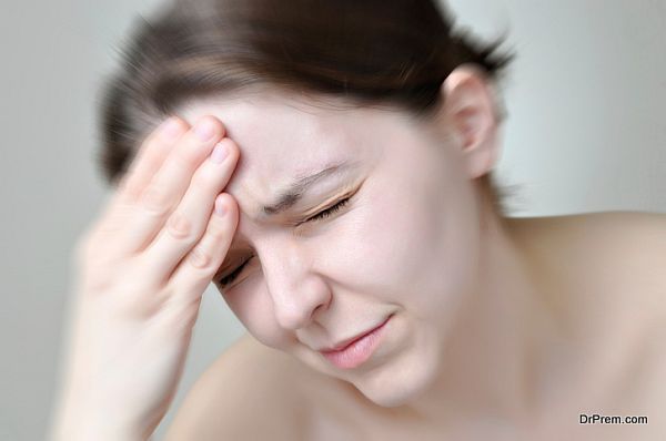 Young woman having headache