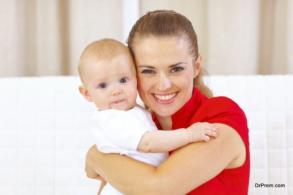 Portrait of lovely baby and young mother