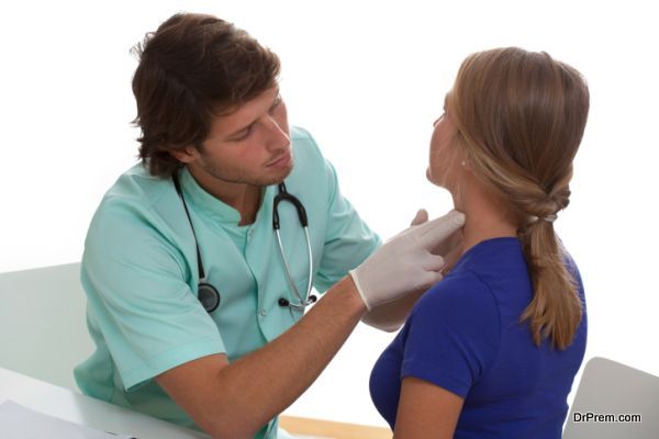 Endocrinologist testing a thyroid