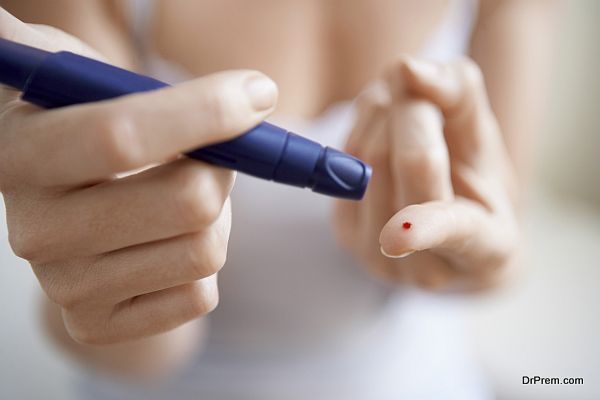 Woman Using Lancelet On Finger